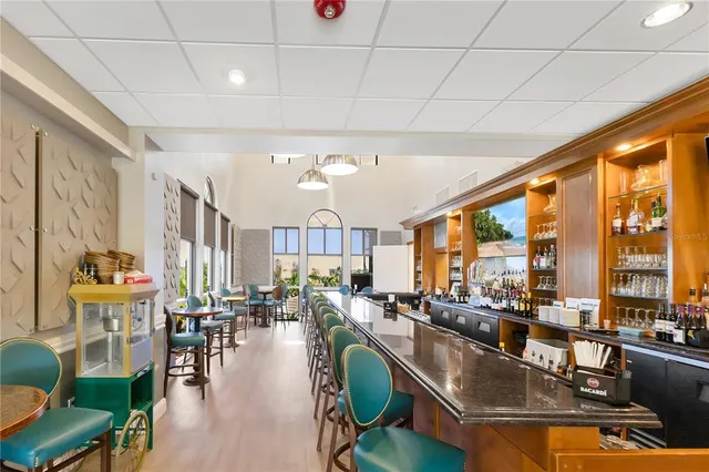 a living room with lots of furniture and a large window