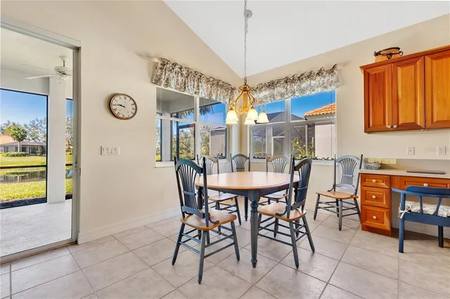 a dining room with furniture and window