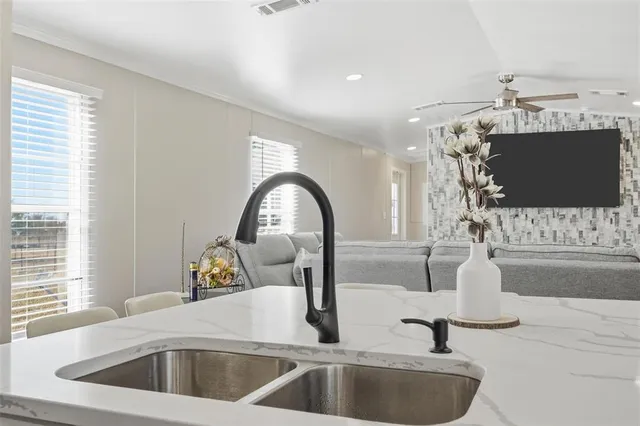 a kitchen with a sink and a window