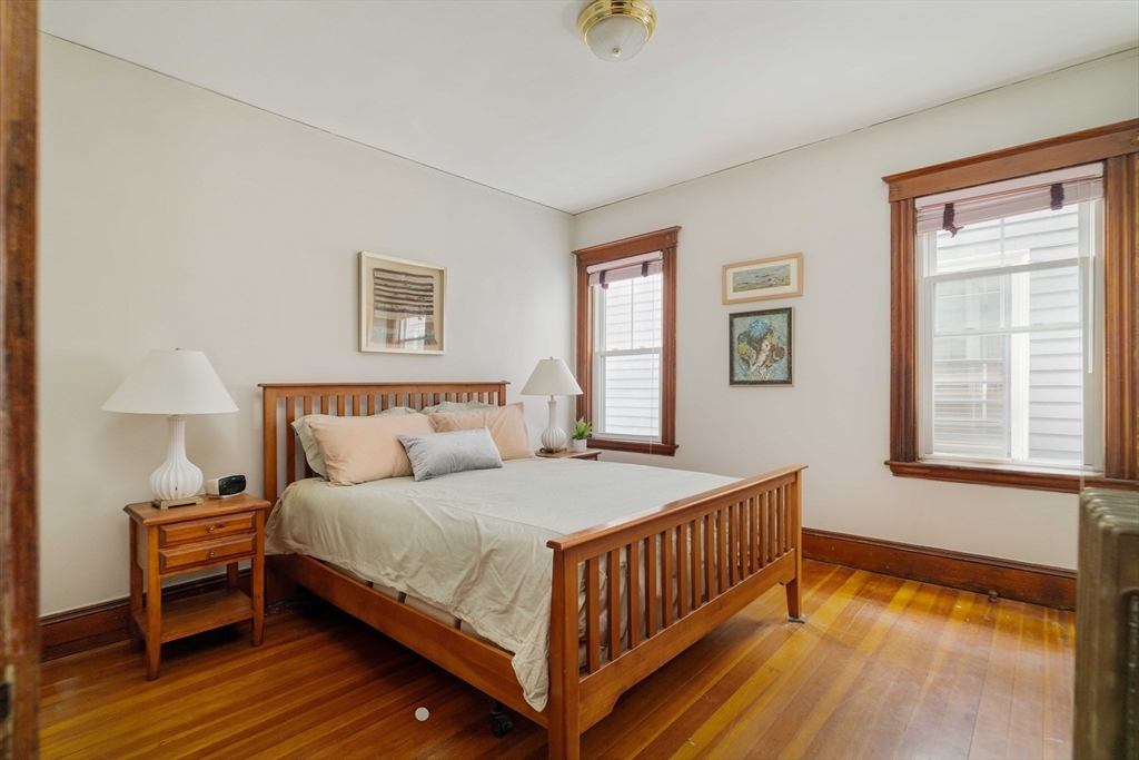 59 Pemberton Street, Unit 1 Cambridge, MA 02140 - Photo 19 of 30 a bedroom with a bed and a window