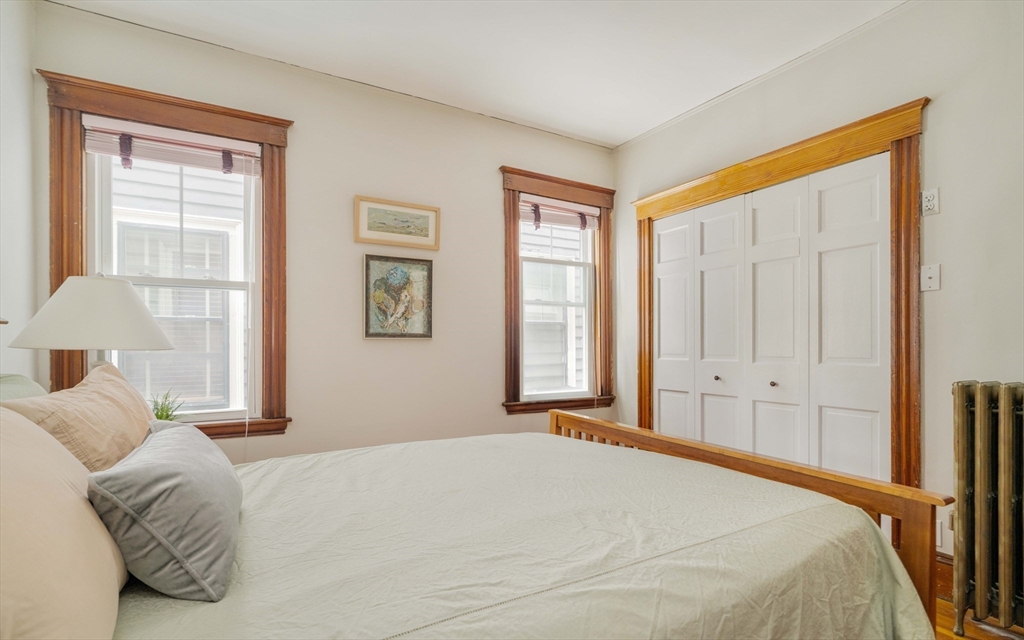 59 Pemberton Street, Unit 1 Cambridge, MA 02140 - Photo 21 of 30 a bedroom with a bed and a window
