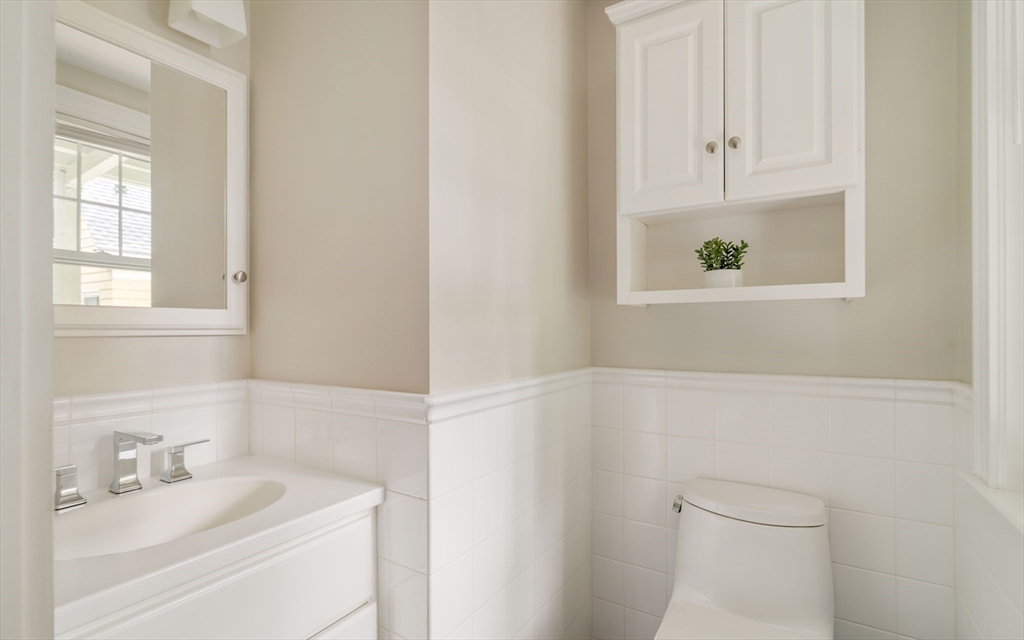 59 Pemberton Street, Unit 1 Cambridge, MA 02140 - Photo 27 of 30 a bathroom with a sink a toilet and a window