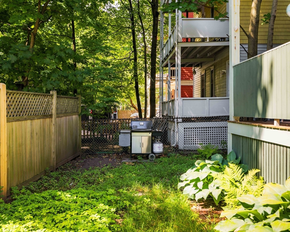 59 Pemberton Street, Unit 1 Cambridge, MA 02140 - Photo 30 of 30 a view of a garden with wooden fence