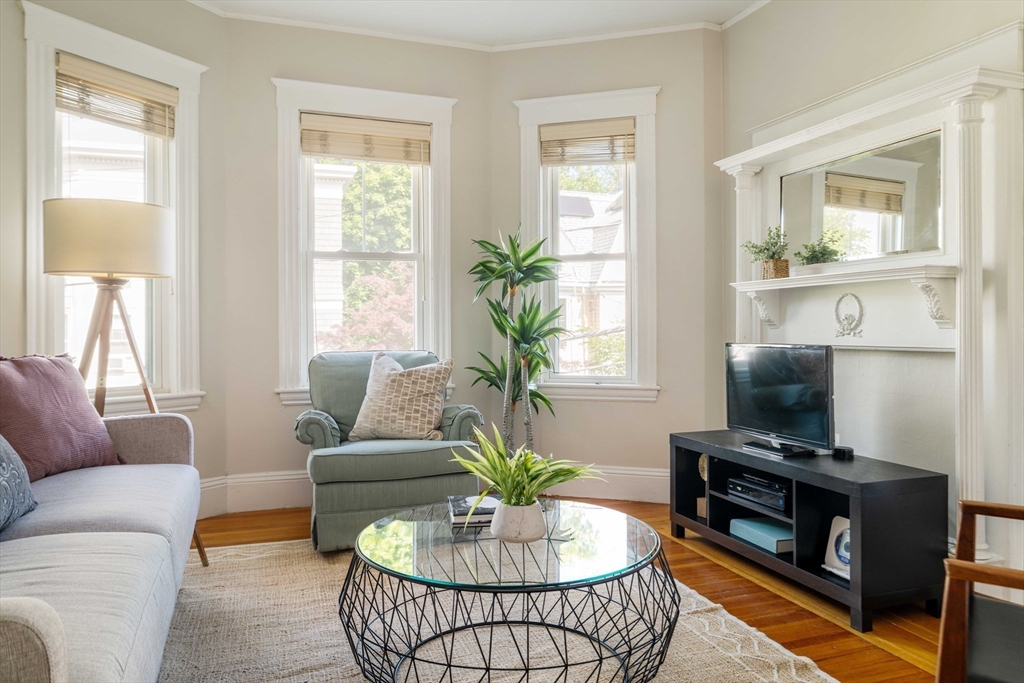 59 Pemberton Street, Unit 1 Cambridge, MA 02140 - Photo 6 of 30 a living room with furniture lamp and window