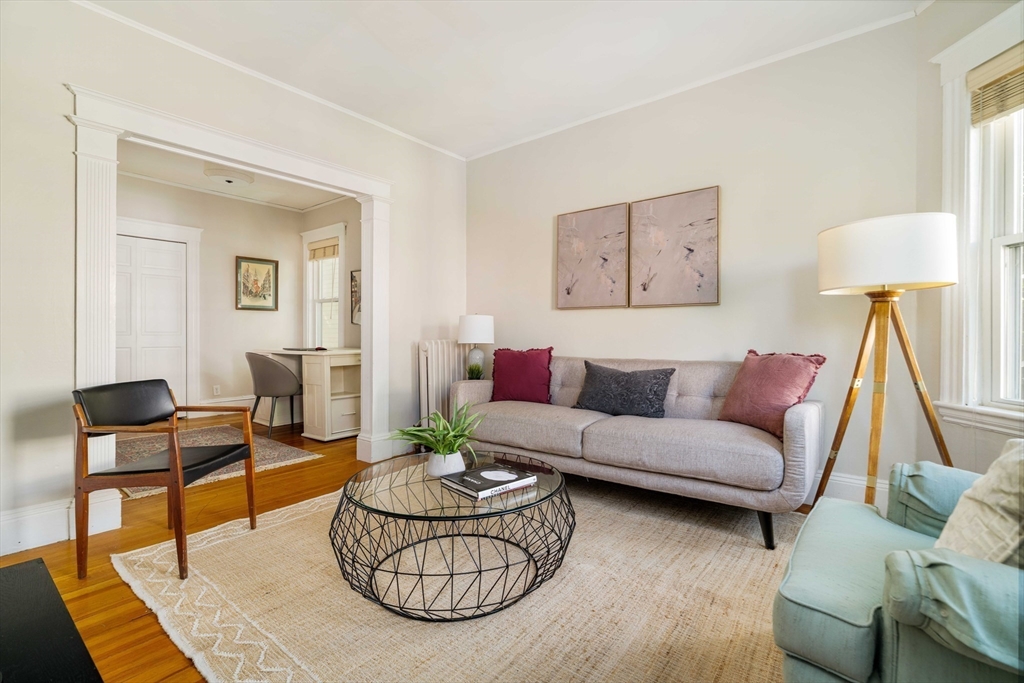 59 Pemberton Street, Unit 1 Cambridge, MA 02140 - Photo 7 of 30 a living room with furniture and a rug