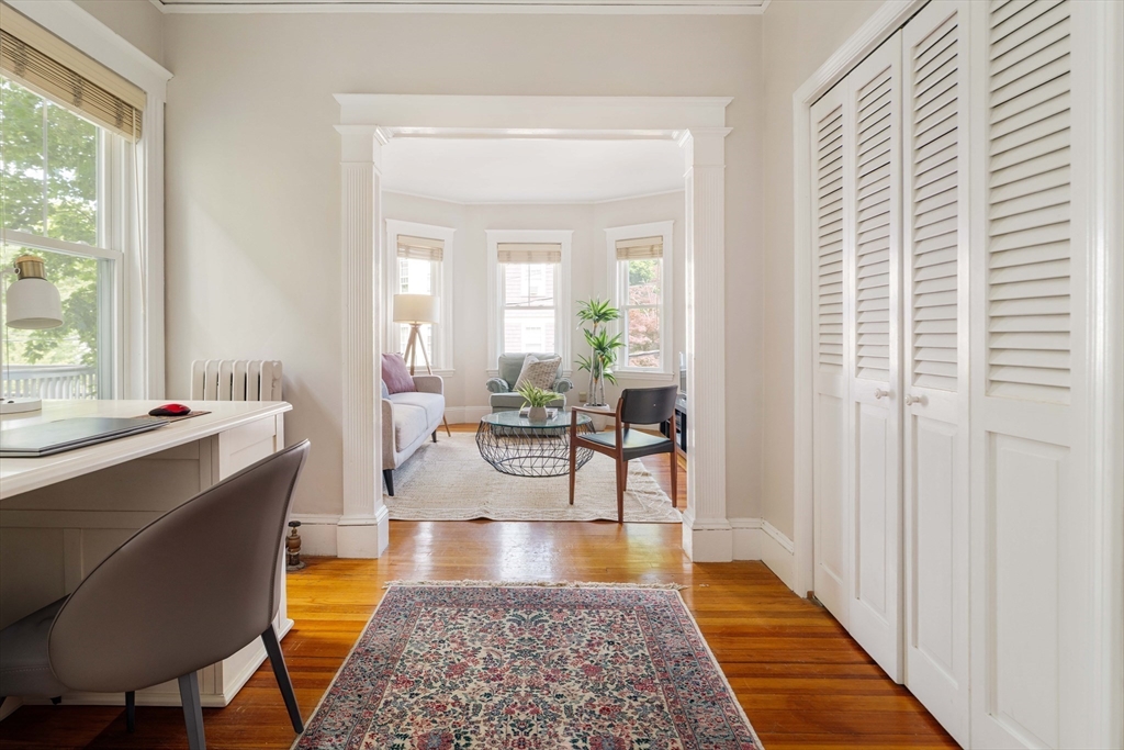 59 Pemberton Street, Unit 1 Cambridge, MA 02140 - Photo 8 of 30 a living room with furniture and a rug