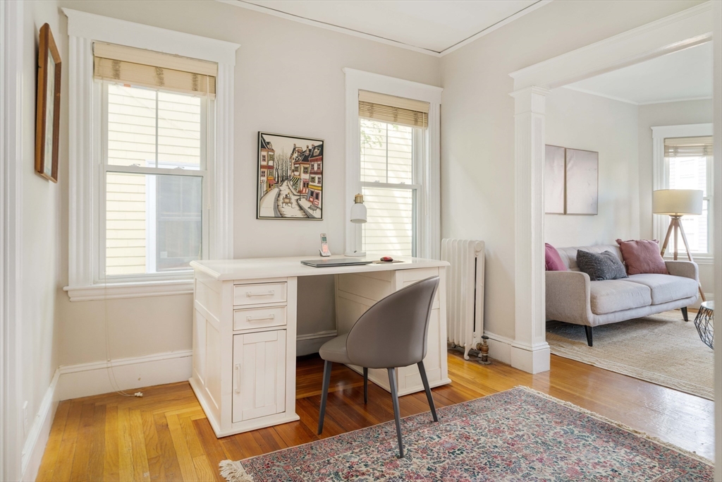 59 Pemberton Street, Unit 1 Cambridge, MA 02140 - Photo 9 of 30 a living room with furniture and a window