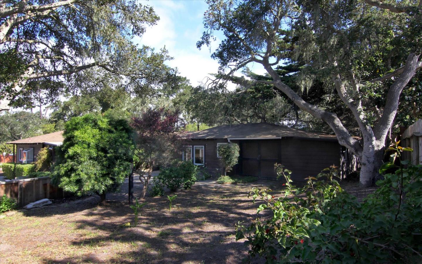 1251 Pacific Street Monterey, CA 93940 - Photo 18 of 25 a front view of a house with a garden