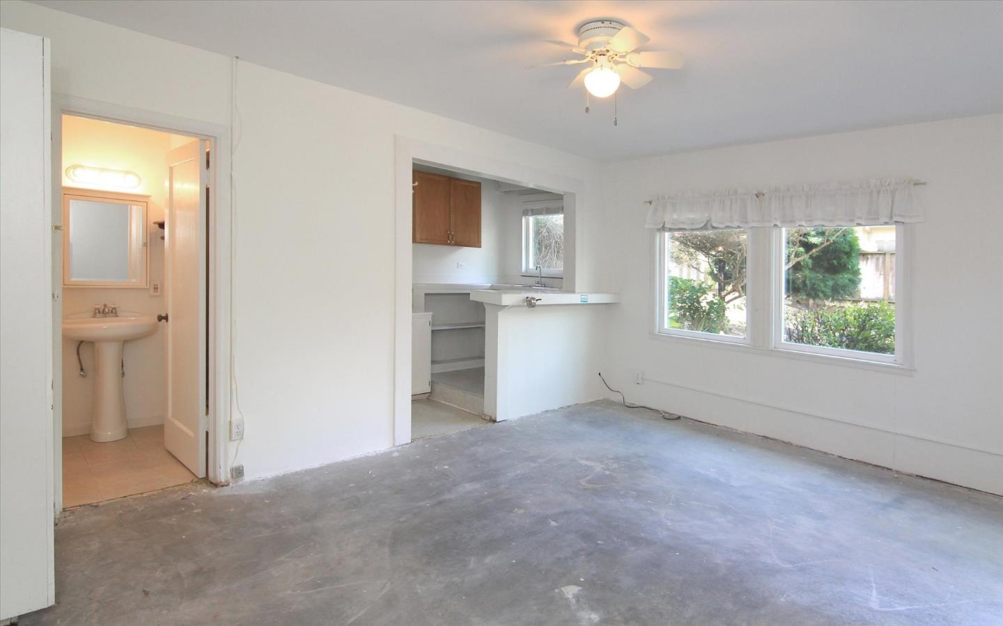 1251 Pacific Street Monterey, CA 93940 - Photo 21 of 25 a view of empty room with window and ceiling fan