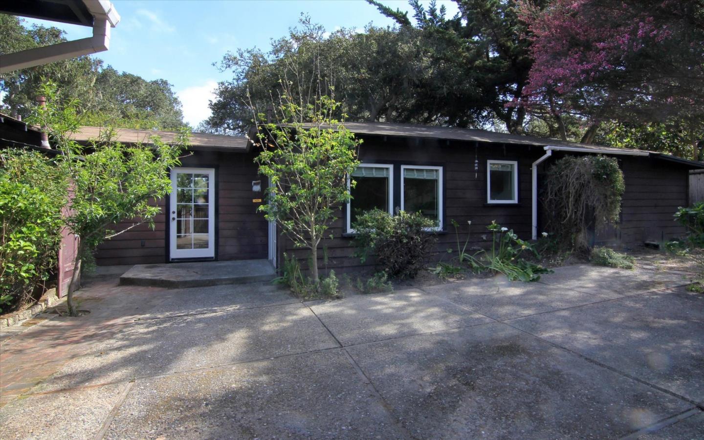 1251 Pacific Street Monterey, CA 93940 - Photo 23 of 25 a view of an house with backyard space and garden