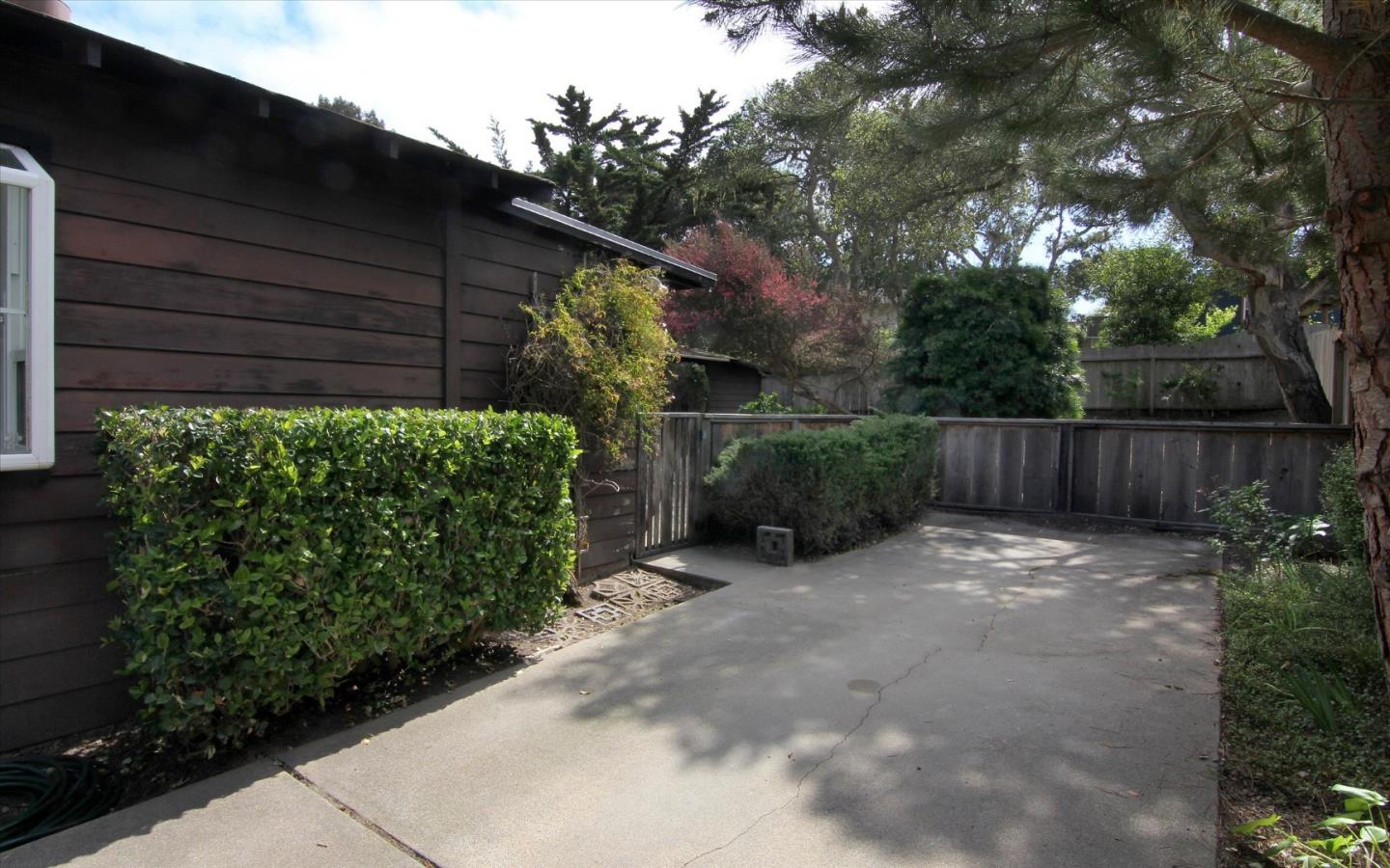 1251 Pacific Street Monterey, CA 93940 - Photo 25 of 25 a backyard of a house with lots of green space