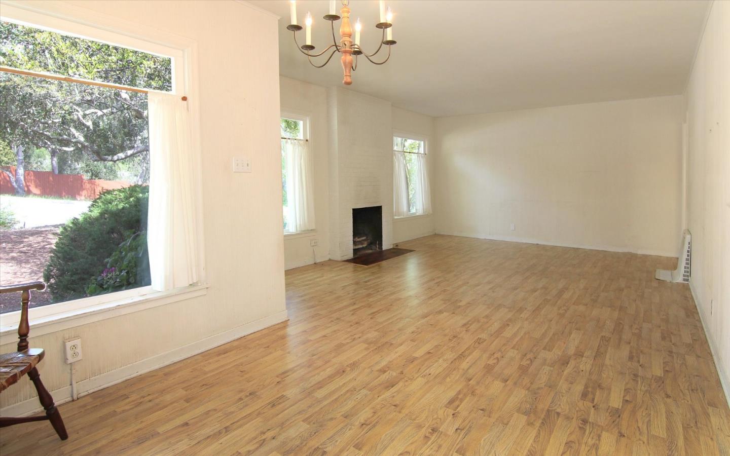 1251 Pacific Street Monterey, CA 93940 - Photo 6 of 25 a view of a livingroom with wooden floor and a window