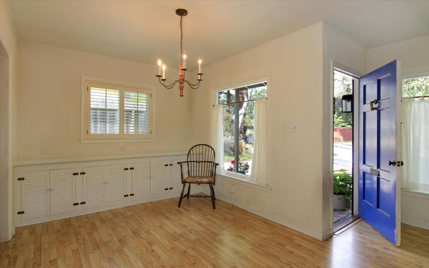 1251 Pacific Street Monterey, CA 93940 - Photo 7 of 25 a view of an empty room with window and wooden floor