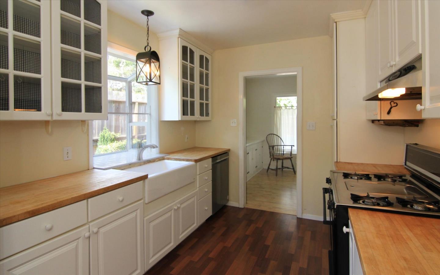 1251 Pacific Street Monterey, CA 93940 - Photo 9 of 25 a kitchen with a sink appliances and cabinets