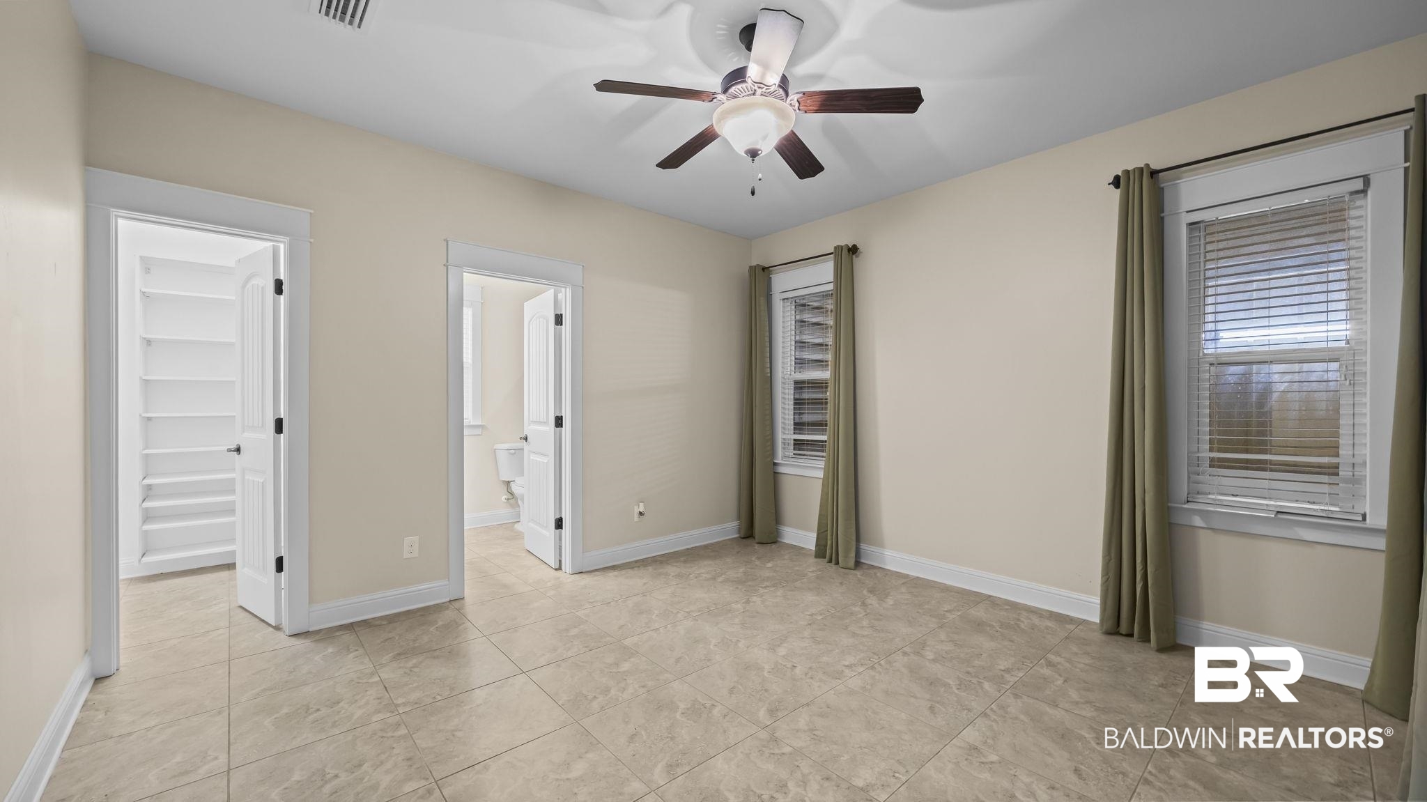 12361 Reunion Place Foley, AL 36535 - Photo 18 of 43 Unfurnished bedroom featuring a spacious closet and ceiling fan