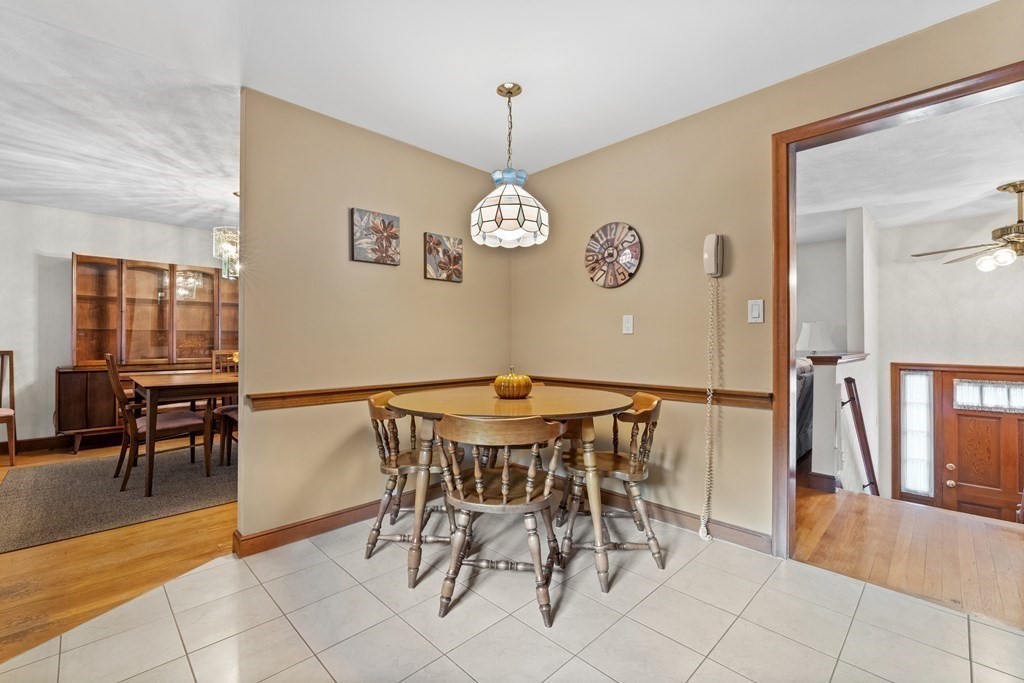 135 Rustic Road Walpole, MA 02032 - Photo 13 of 37 a view of a dining room with furniture and chandelier