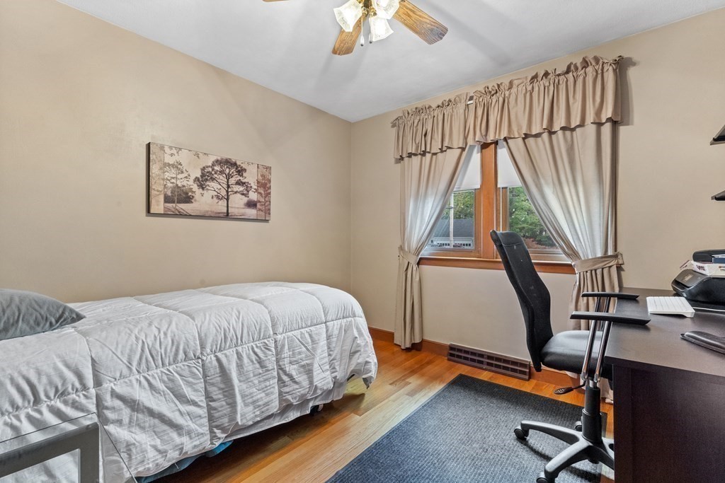 135 Rustic Road Walpole, MA 02032 - Photo 17 of 37 a bedroom with a bed and a window