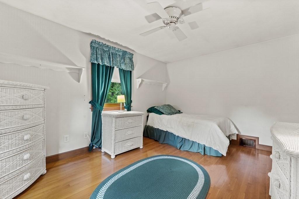 135 Rustic Road Walpole, MA 02032 - Photo 20 of 37 a bedroom with a bed and a dresser