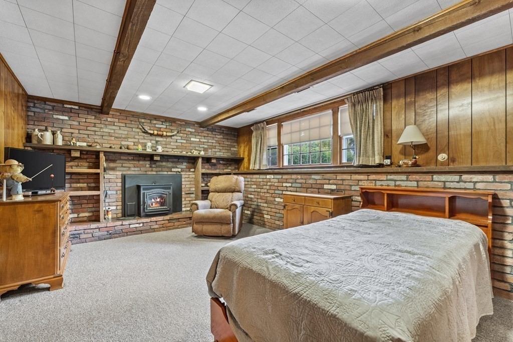 135 Rustic Road Walpole, MA 02032 - Photo 25 of 37 a view of a kitchen with furniture and fireplace
