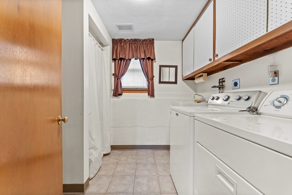 135 Rustic Road Walpole, MA 02032 - Photo 27 of 37 a utility room with dryer and washer