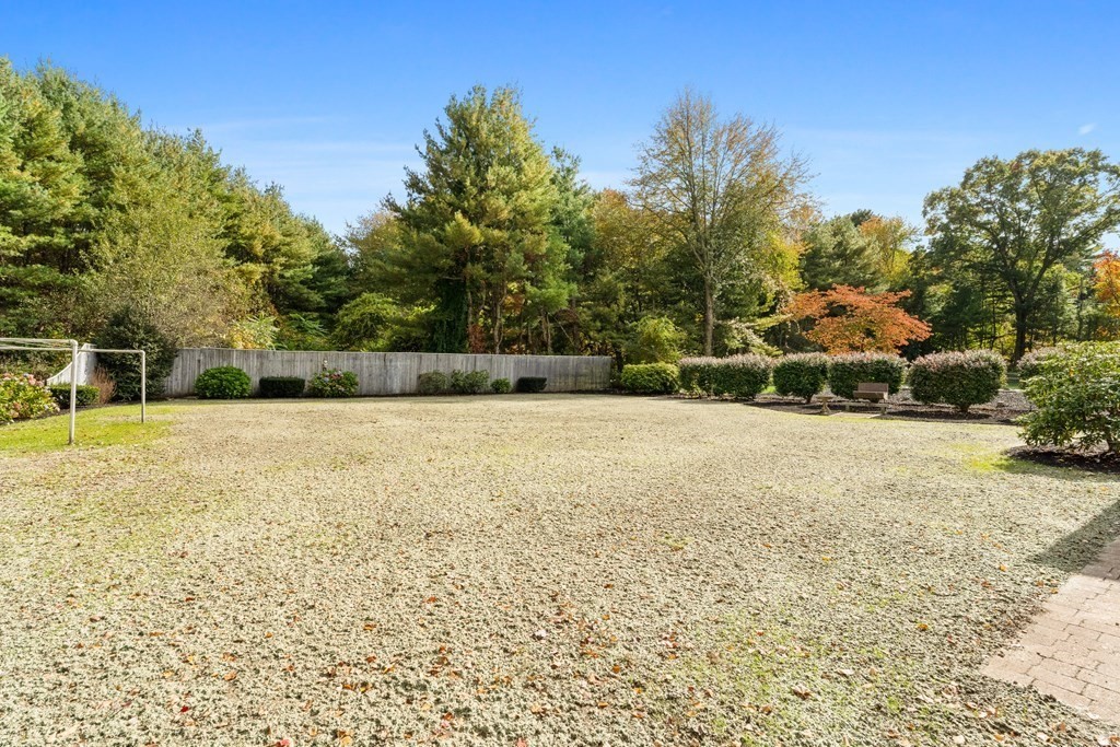 135 Rustic Road Walpole, MA 02032 - Photo 31 of 37 a view of yard with swimming pool and trees