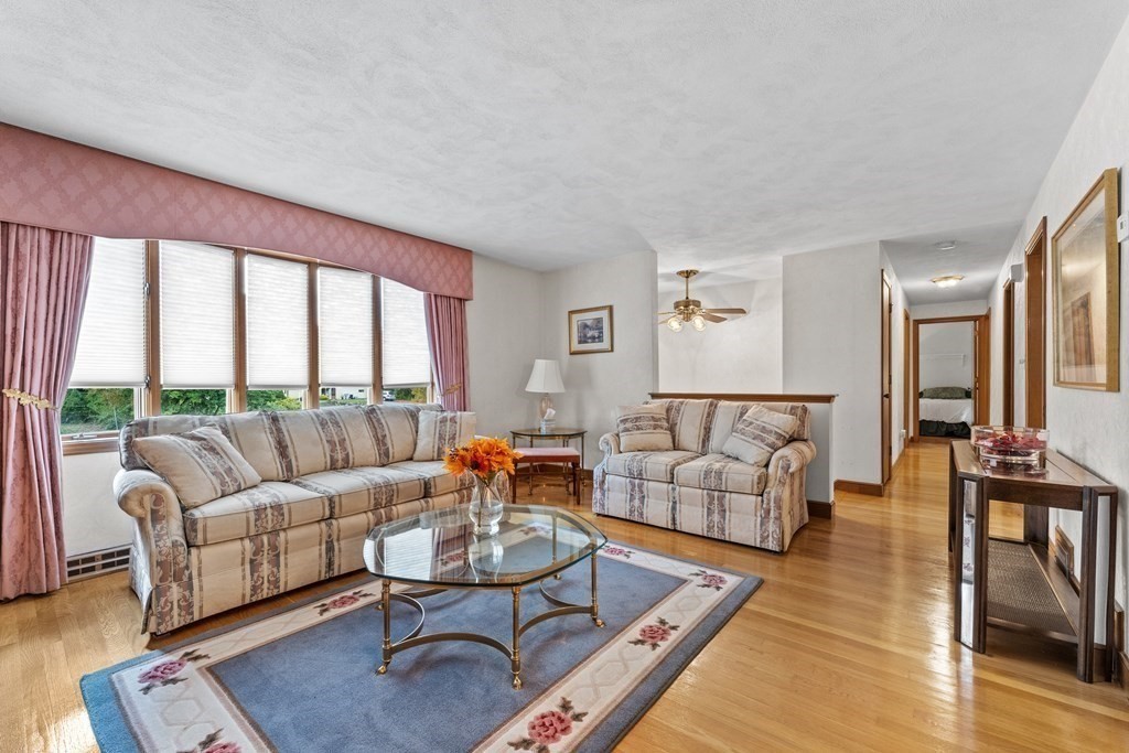 135 Rustic Road Walpole, MA 02032 - Photo 5 of 37 a living room with furniture and a large window