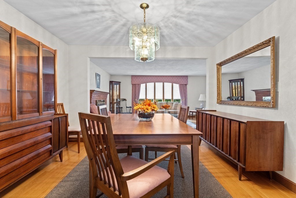 135 Rustic Road Walpole, MA 02032 - Photo 7 of 37 a view of a dining room with furniture window and wooden floor
