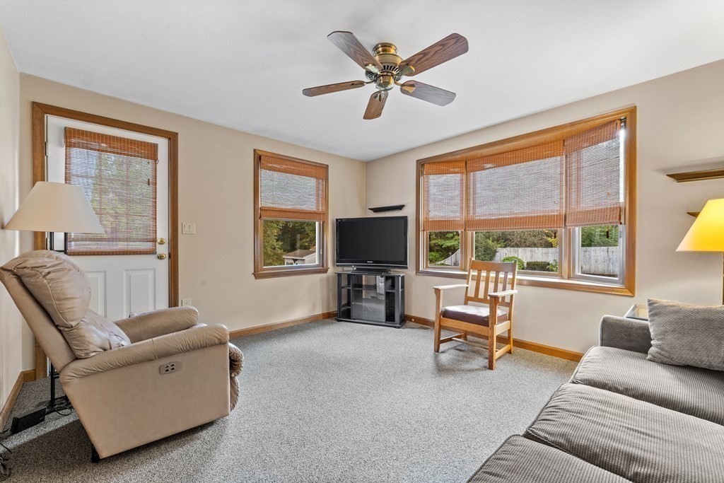 135 Rustic Road Walpole, MA 02032 - Photo 9 of 37 a living room with furniture and a flat screen tv