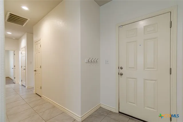 a view of a hallway with closet area