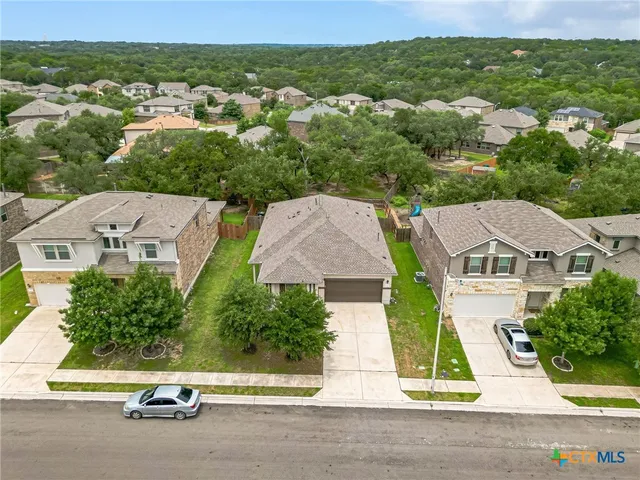 an aerial view of residential houses and street