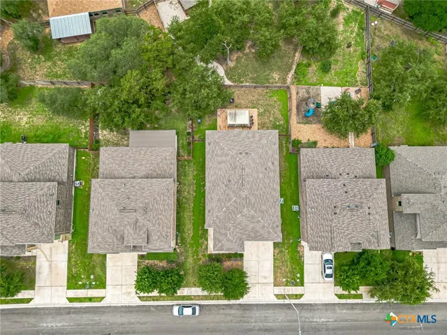 an aerial view of a house with a garden