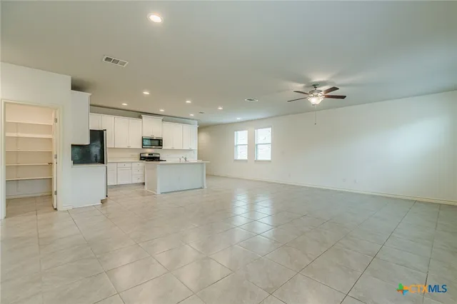 a view of kitchen with furniture and window