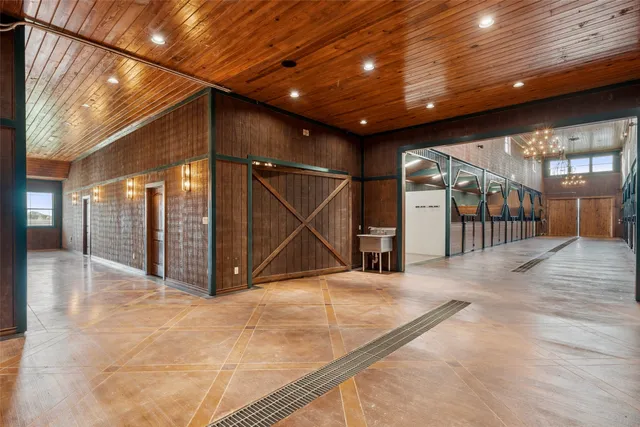 a kitchen with a sink a stove and cabinets