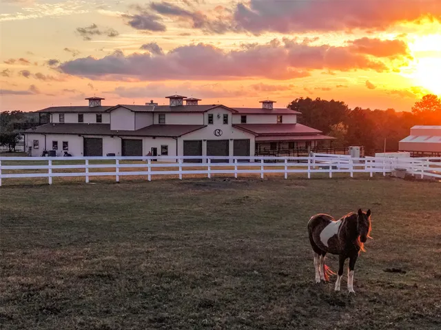 a bathroom with a glass door shower and vanity