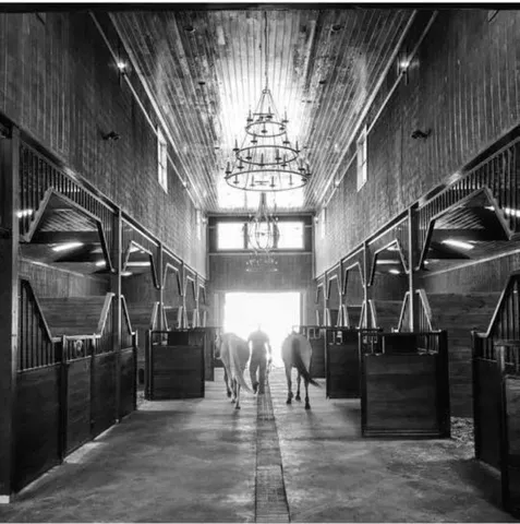 a kitchen with stainless steel appliances granite countertop a table chairs and a refrigerator