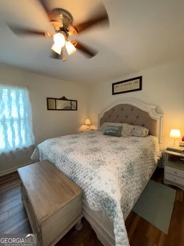 a bathroom with a toilet and a shower curtain
