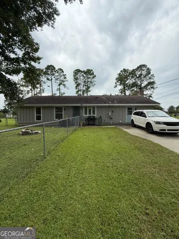 a backyard of a house with lots of green space