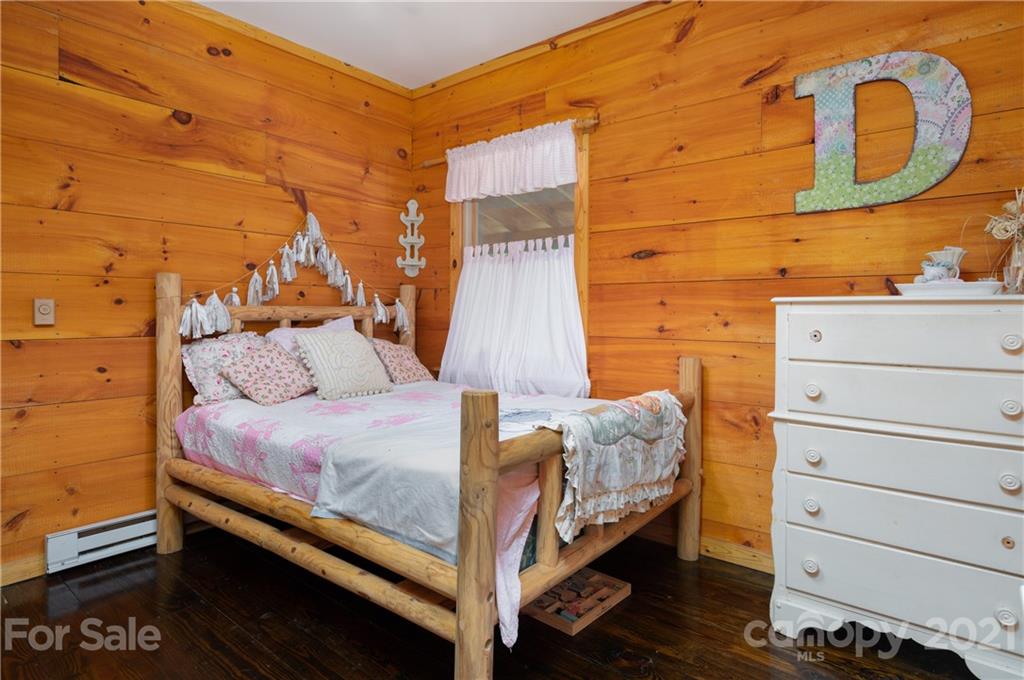 84 Blossom Road Brevard, NC 28712 - Photo 11 of 19 a bed room with a bed and a window