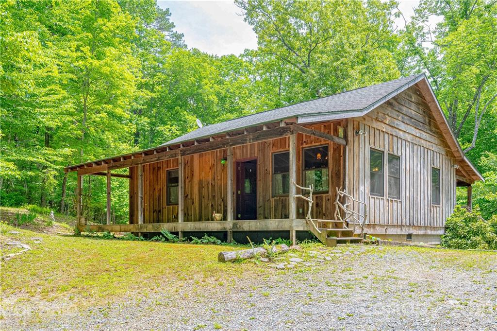84 Blossom Road Brevard, NC 28712 - Photo 15 of 19 a view of a house with backyard and garden
