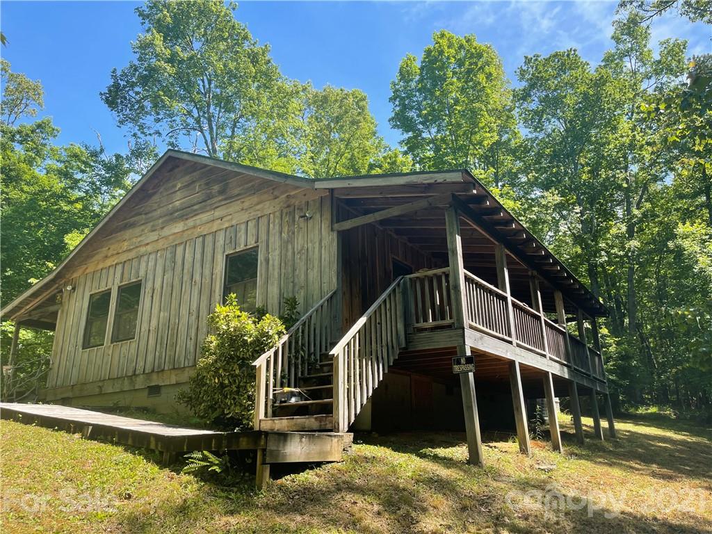 84 Blossom Road Brevard, NC 28712 - Photo 19 of 19 a view of a house with a yard