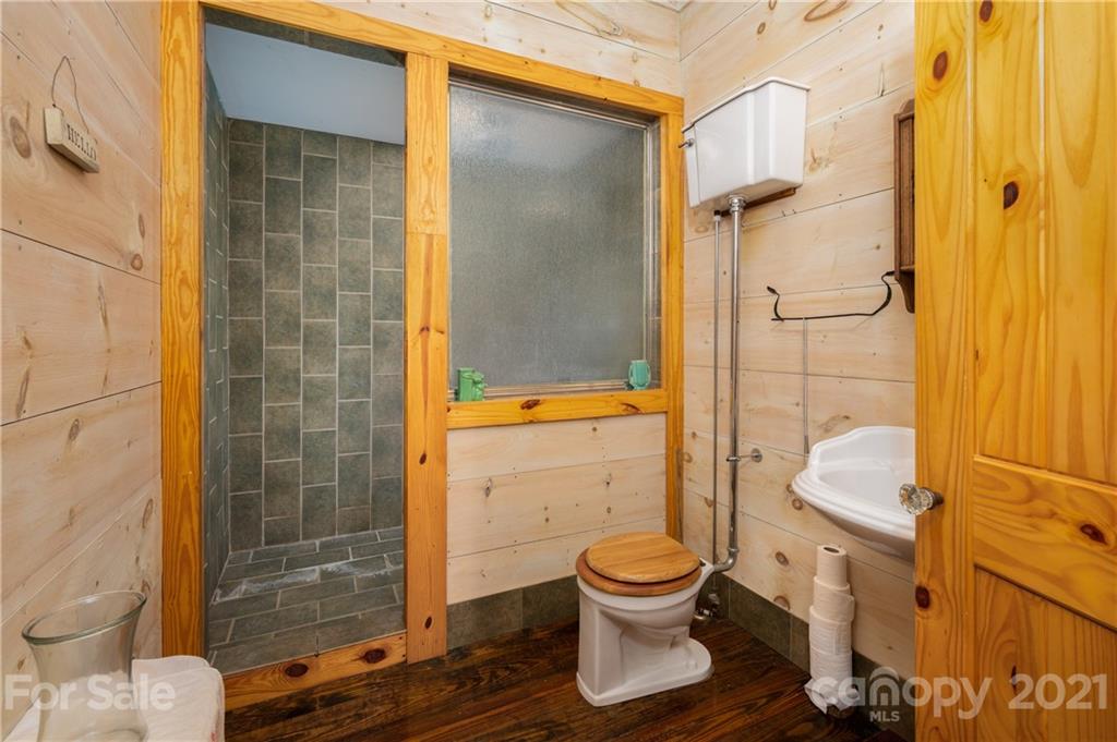 84 Blossom Road Brevard, NC 28712 - Photo 7 of 19 a bathroom with a toilet and a shower