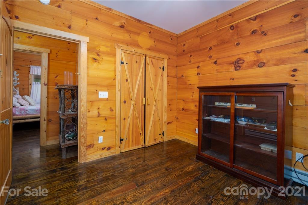 84 Blossom Road Brevard, NC 28712 - Photo 9 of 19 wooden floor and chair in a room