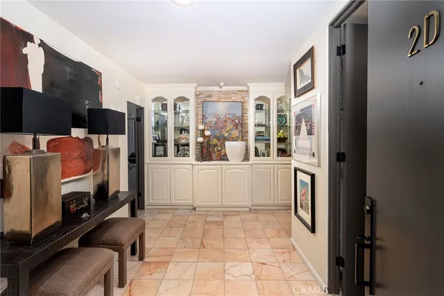 a room with stainless steel appliances furniture and a view of kitchen