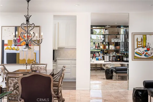 a view of kitchen with stainless steel appliances granite countertop a sink and a refrigerator