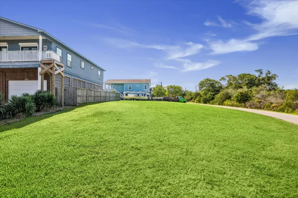 a view of a garden with a building in the background