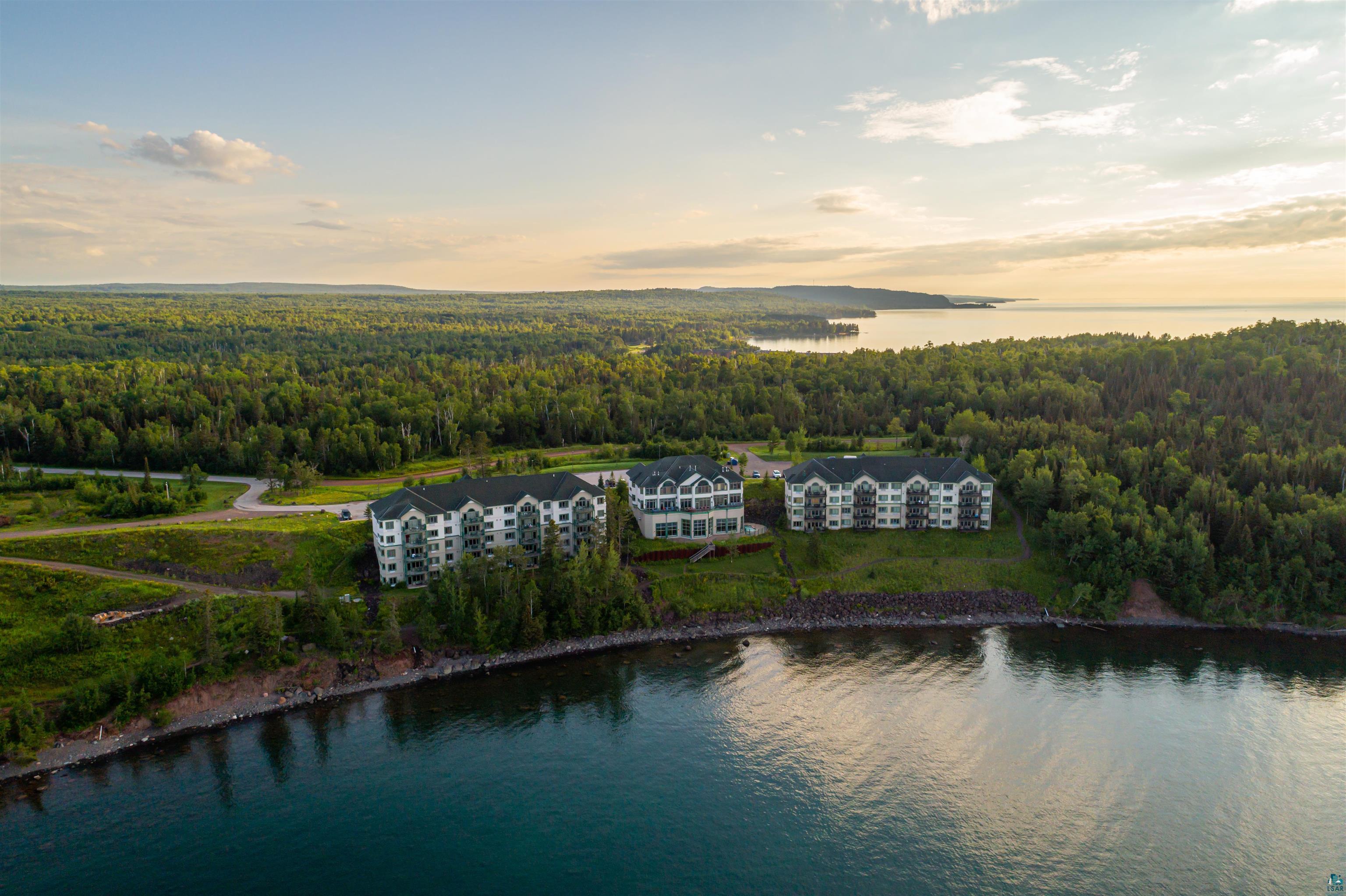 Two Burlington Road, Unit 5404 Two Harbors, MN 55616 - Photo 27 of 27 Aerial view at dusk featuring a view of trees and a water view