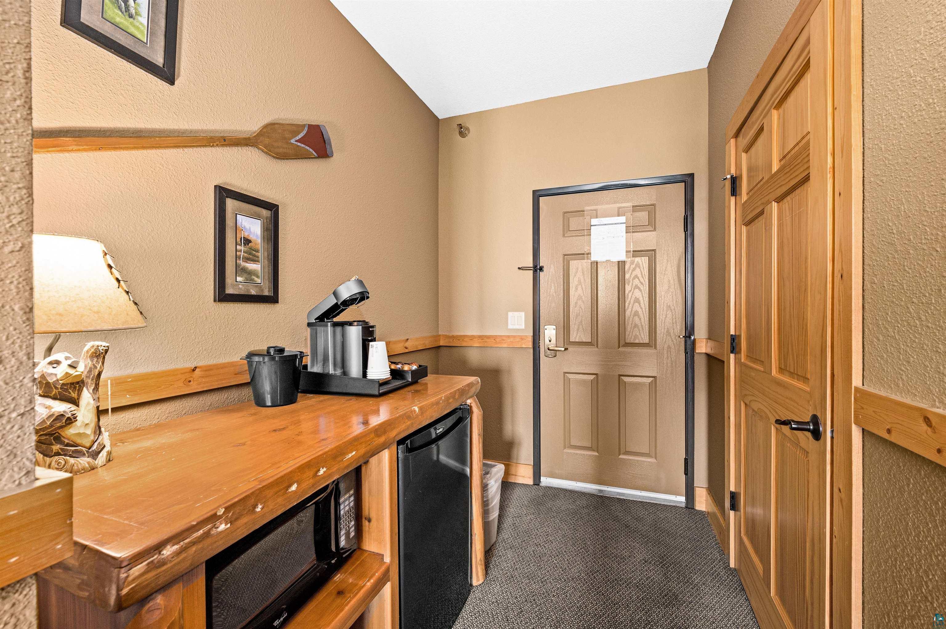 Two Burlington Road, Unit 5404 Two Harbors, MN 55616 - Photo 7 of 27 Office area with lofted ceiling and dark carpet
