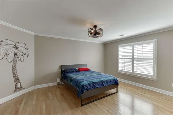 a bedroom with a bed and window