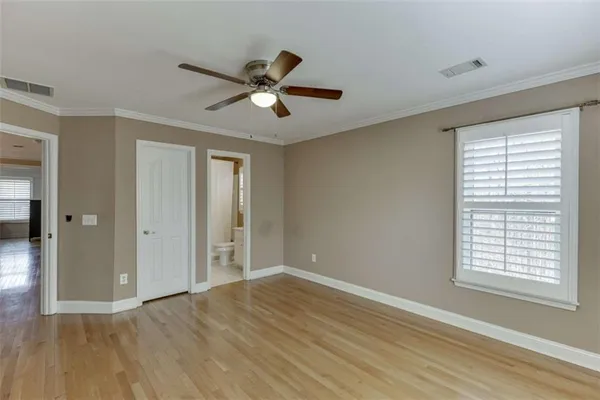 a bath tub sitting in a bathroom next to a window