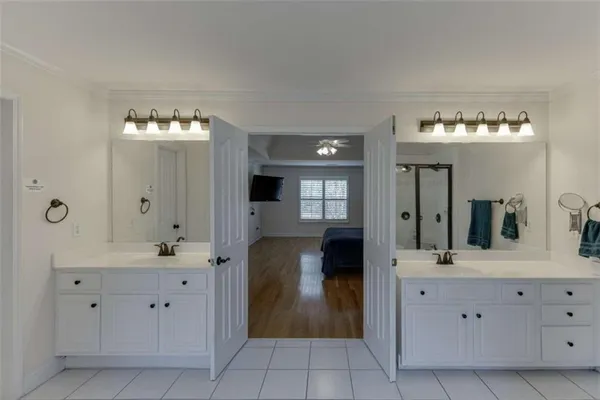 a view of an empty room with window and an empty room